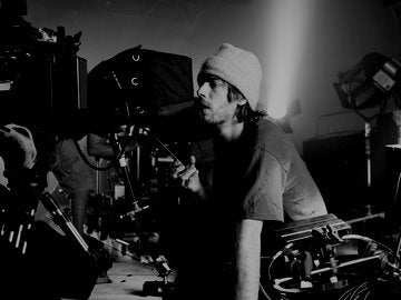 Director behind camera on set