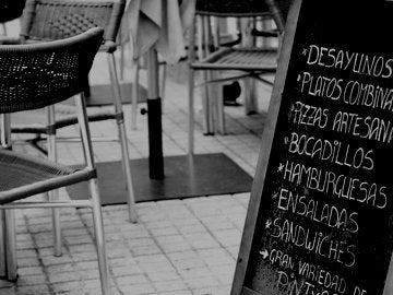 Chalkboard menu in spanish on a terrace